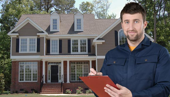 A home inspector in Elkton, MD looking over a home inspection report.